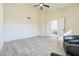 Living room with wood-look floors, neutral tones, and access to other rooms at 4024 E Hiddenview Dr, Phoenix, AZ 85048