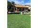 Charming backyard featuring an outdoor patio and lush, green lawn space perfect for entertaining at 4213 W Villa Linda Dr, Glendale, AZ 85310