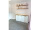 Charming bedroom showcasing floral wallpaper and sleek built-in storage at 4213 W Villa Linda Dr, Glendale, AZ 85310