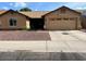 Charming single-story home featuring a two-car garage and low maintenance front yard landscaping at 4213 W Villa Linda Dr, Glendale, AZ 85310