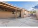 Covered back patio with tile flooring, stucco exterior, and access to backyard at 425 S 93Rd Pl, Mesa, AZ 85208