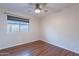 Cozy bedroom featuring laminate flooring and a ceiling fan at 425 S 93Rd Pl, Mesa, AZ 85208
