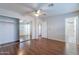 Large bedroom features wood-look floors, ceiling fan and mirrored closet at 425 S 93Rd Pl, Mesa, AZ 85208