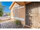 Welcoming front porch with a secure screen door, desert landscaping, and charming curb appeal at 425 S 93Rd Pl, Mesa, AZ 85208