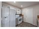 Functional kitchen with white appliances, gray cabinets, and practical layout at 425 S 93Rd Pl, Mesa, AZ 85208
