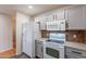Bright kitchen with updated appliances and gray cabinetry, ideal for modern living at 425 S 93Rd Pl, Mesa, AZ 85208