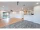 Open floor plan with sliding glass door, modern fan, flowing into the kitchen at 425 S 93Rd Pl, Mesa, AZ 85208