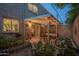 A private backyard boasts a covered patio, garden beds, and a pond perfect for relaxation and outdoor dining at 4431 N 21St Pl, Phoenix, AZ 85016