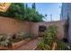 Private backyard with raised garden beds and a barbecue grill creating an ideal space for outdoor cooking at 4431 N 21St Pl, Phoenix, AZ 85016