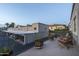 Apartment balcony with chairs overlooking complex, palm trees, and covered parking at 4431 N 21St Pl, Phoenix, AZ 85016