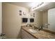 Bathroom featuring granite countertop, a large mirror, and updated fixtures at 4431 N 21St Pl, Phoenix, AZ 85016