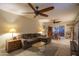 Bright and spacious living room features a comfortable sofa, tile floors, ceiling fans and easy access to the backyard at 4431 N 21St Pl, Phoenix, AZ 85016