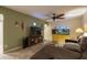 Stylish living room featuring a cozy seating area, entertainment center with fireplace, and a vibrant aquarium at 4431 N 21St Pl, Phoenix, AZ 85016