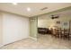 Open-plan living room featuring tile flooring, neutral paint colors, and ample natural light at 4431 N 21St Pl, Phoenix, AZ 85016