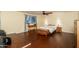 Primary bedroom featuring hardwood floors, seating area, and large window with ample sunlight at 4431 N 21St Pl, Phoenix, AZ 85016