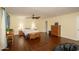 Spacious primary bedroom with hardwood floors, ceiling fan, and ample space for seating at 4431 N 21St Pl, Phoenix, AZ 85016