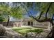 The backyard features desert landscaping, artificial grass, and decorative stone pillars, creating a serene outdoor space at 4512 W Rushmore Dr, Anthem, AZ 85087