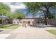 Paver patio in backyard with turf and desert landscaping at 4512 W Rushmore Dr, Anthem, AZ 85087