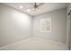 Neutral bedroom with a ceiling fan, recessed lighting, and a shuttered window at 4512 W Rushmore Dr, Anthem, AZ 85087