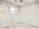 This bedroom is bright with a fan, nice floors and a walk-in closet at 4512 W Rushmore Dr, Anthem, AZ 85087