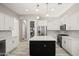 Kitchen featuring white cabinetry, stainless appliances, granite countertops, and large center island at 4512 W Rushmore Dr, Anthem, AZ 85087