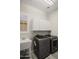 Laundry room featuring a sink, cabinets, and a modern washer and dryer set at 4512 W Rushmore Dr, Anthem, AZ 85087