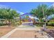 A vibrant community playground with colorful equipment and safety features, providing a fun and secure place for children to play at 4512 W Rushmore Dr, Anthem, AZ 85087
