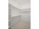 Walk-in closet featuring shelving, rod and pole, and carpet flooring at 4512 W Rushmore Dr, Anthem, AZ 85087