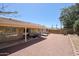 Expansive backyard featuring a covered patio, lush greenery, and comfortable lounge chairs at 4558 E Libby St, Phoenix, AZ 85032