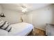 Cozy bedroom with modern ceiling fan, a closet, and plush bedding, creating a relaxing retreat at 4558 E Libby St, Phoenix, AZ 85032