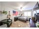 Comfortable bedroom with ceiling fan, mounted guitars and an American flag, creating a lively atmosphere at 4558 E Libby St, Phoenix, AZ 85032