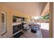 Relaxing covered patio with comfortable seating and sliding glass doors at 4558 E Libby St, Phoenix, AZ 85032