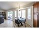 Cozy dining area with a modern table set by bright windows and a sliding glass door at 4558 E Libby St, Phoenix, AZ 85032