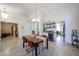 Dining room featuring a table, wine bar, and tile flooring at 4558 E Libby St, Phoenix, AZ 85032