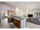 Open kitchen with granite countertops, stainless appliances, and cozy living area at 4558 E Libby St, Phoenix, AZ 85032