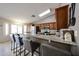 Beautiful kitchen with granite countertops, stainless steel appliances, and barstool seating at 4558 E Libby St, Phoenix, AZ 85032