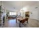Bright living room with a dining area, neutral sofa, and access to a home gym at 4558 E Libby St, Phoenix, AZ 85032