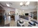 Open-concept living space featuring a dining area, kitchen, and comfortable lounge area at 4558 E Libby St, Phoenix, AZ 85032