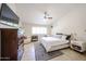 Spacious main bedroom with a ceiling fan and a large window for lots of natural light at 4558 E Libby St, Phoenix, AZ 85032