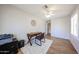 Versatile home office with desk, chair, printer, and natural light for productivity and comfort at 4558 E Libby St, Phoenix, AZ 85032