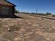 View of the spacious, partially landscaped backyard surrounded by a chain link fence at 5122 E Shadow Ln, San Tan Valley, AZ 85140