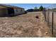 View of a spacious, partially landscaped backyard with chain link fence at 5122 E Shadow Ln, San Tan Valley, AZ 85140