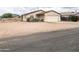 Charming single-story home featuring desert landscaping, attached garage, and quaint curb appeal at 5122 E Shadow Ln, San Tan Valley, AZ 85140