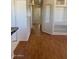 An hallway featuring wood floors and white walls at 5122 E Shadow Ln, San Tan Valley, AZ 85140