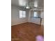 An open-concept living room featuring wood floors and a ceiling fan at 5122 E Shadow Ln, San Tan Valley, AZ 85140