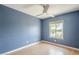 Bedroom with a large window and stunning blue accent wall at 5330 E Tierra Buena Ln, Scottsdale, AZ 85254