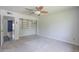 Well-lit bedroom with neutral walls, carpet, and built-in closet, offering a calming space at 5330 E Tierra Buena Ln, Scottsdale, AZ 85254