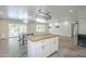 Open concept living area with butcher block island, access to pool, and ceiling fans at 5330 E Tierra Buena Ln, Scottsdale, AZ 85254
