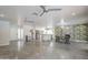Spacious living room with polished concrete floors, modern lighting, and open floor plan at 5330 E Tierra Buena Ln, Scottsdale, AZ 85254