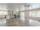 Bright living room with polished concrete floors, fireplace and sliding door access to backyard at 5330 E Tierra Buena Ln, Scottsdale, AZ 85254